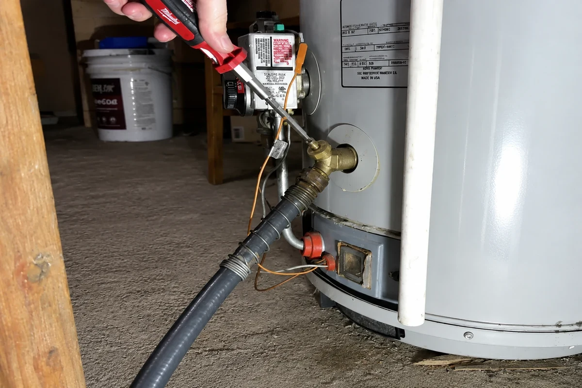 Sespe Plumbing Pros technician working on a water heater in Fillmore, CA